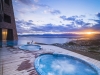 Outdoor swimming pool and jacuzzi at sunset 4